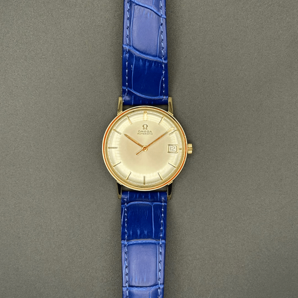 Gold plated vintage Omega watch with a blue strap 