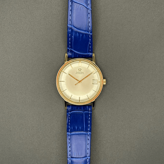 Gold plated vintage Omega watch with a blue strap 