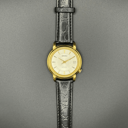 Seiko 7002-8010 Automatic, 1970s, Gold Tone champagne dial with black strap