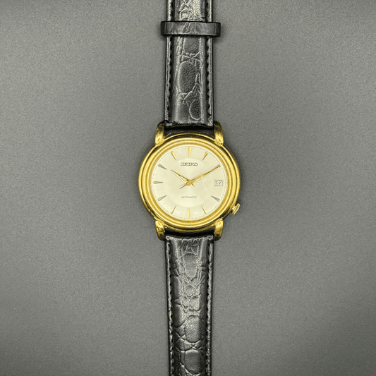 Seiko 7002-8010 Automatic, 1970s, Gold Tone champagne dial with black strap
